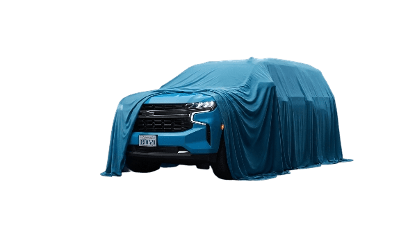 A car under a cover, waiting to be revealed